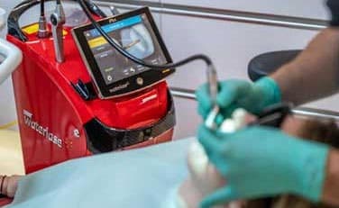 Dr. Sethi on video call. Professional setting.